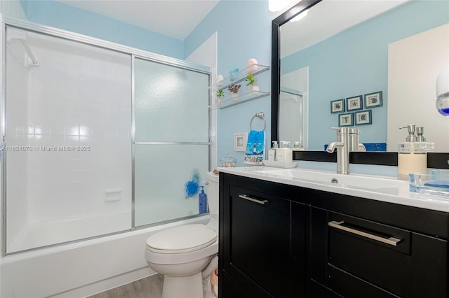 8445 SW 80th Pl, Miami, FL 33143 - bathroom with vanity, wood finished floors, and bath / shower combo with glass door