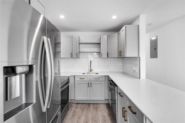 6117 NW 9th St, Margate, FL 33063 - kitchen featuring stainless steel appliances, electric panel, gray cabinetry, open shelves, and recessed lighting