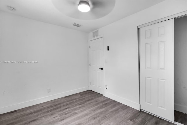 6117 NW 9th St, Margate, FL 33063 - unfurnished bedroom with a closet, wood finished floors, and a ceiling fan