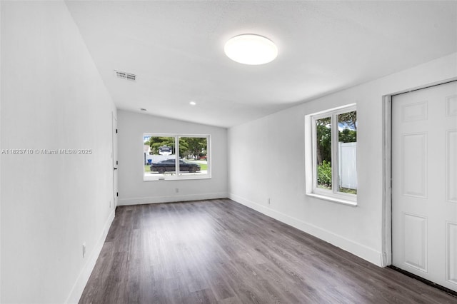 6117 NW 9th St, Margate, FL 33063 - spare room featuring vaulted ceiling and dark wood-type flooring