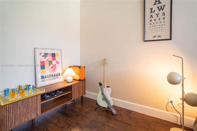 office space with wood finished floors and baseboards