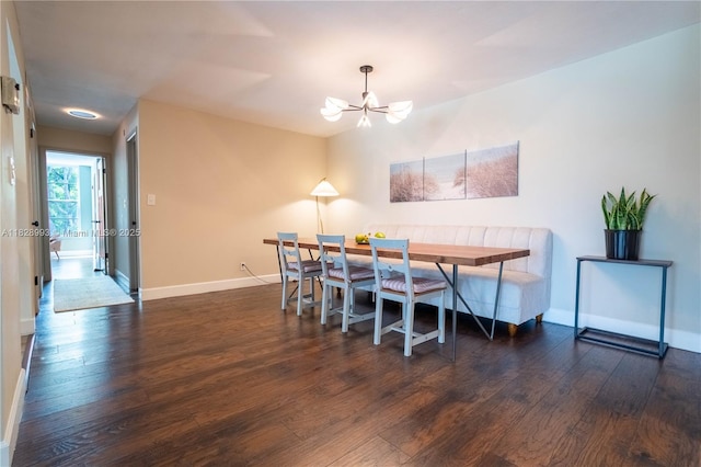 dining area featuring a chandelier, hardwood / wood-style flooring, and breakfast area