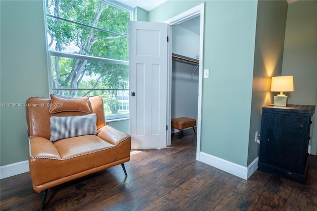 sitting room with wood finished floors and baseboards