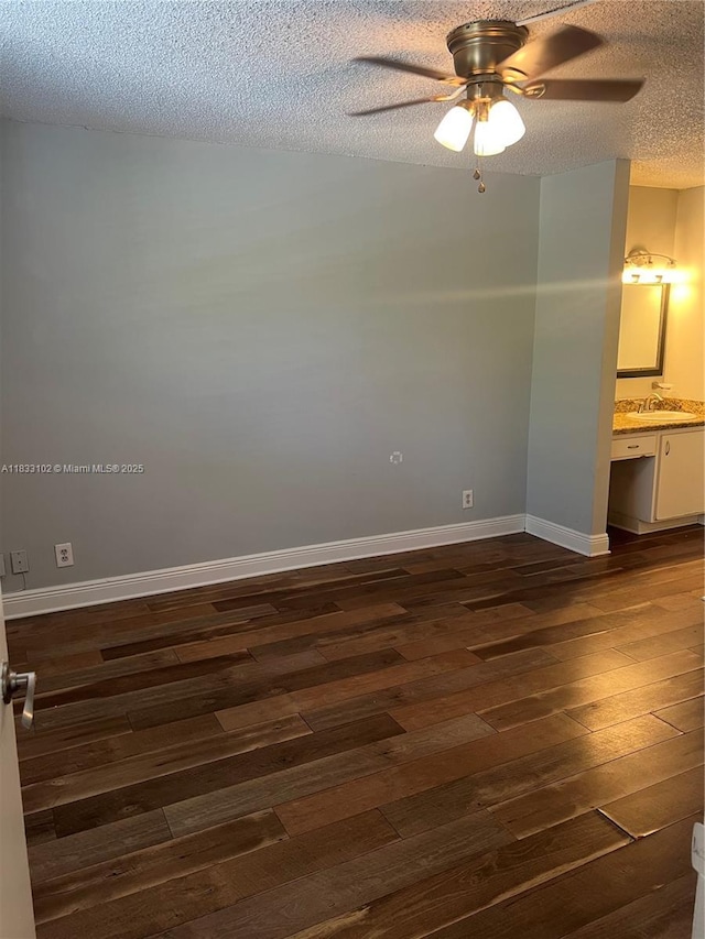 10725 Cleary Blvd Unit 205, Plantation, FL 33324 - empty room featuring dark wood finished floors, a textured ceiling, and a ceiling fan
