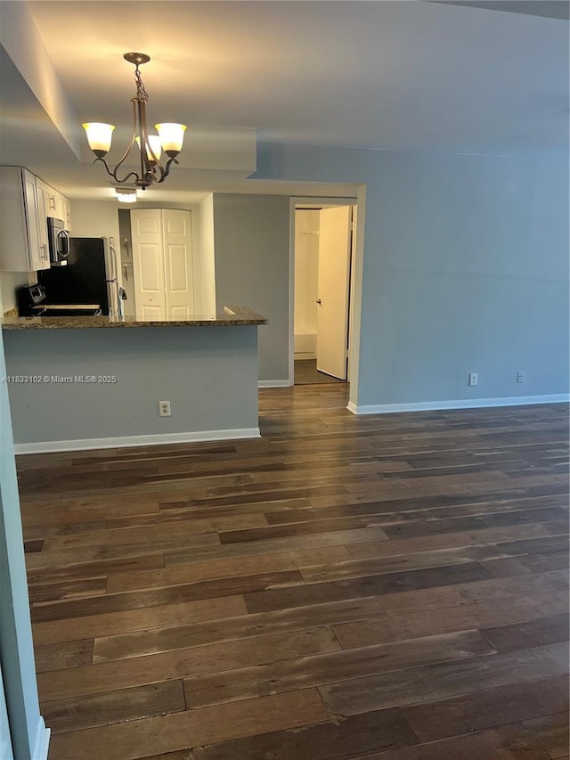 10725 Cleary Blvd Unit 205, Plantation, FL 33324 - kitchen with a chandelier, dark wood finished floors, dark stone countertops, and stainless steel microwave
