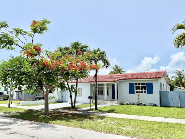 2145 SW 26th St, Miami, FL 33133 - ranch-style house featuring a tiled roof and stucco siding
