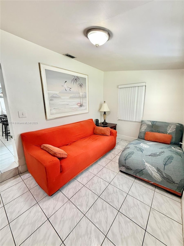 2145 SW 26th St, Miami, FL 33133 - living area with light tile patterned floors and baseboards