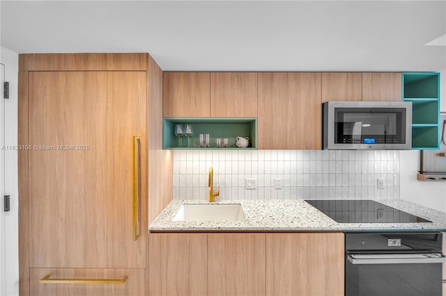 601NE 1st Ave Unit 3309, Miami, FL 33132 - kitchen with black appliances, open shelves, decorative backsplash, and light stone counters