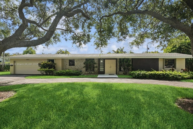15471 SW 83rd Ave, Palmetto Bay, FL 33157 - ranch-style home featuring concrete driveway, a front lawn, stucco siding, and an attached garage