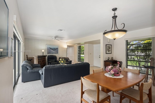 15471 SW 83rd Ave, Palmetto Bay, FL 33157 - dining area featuring healthy amount of natural light, a ceiling fan, and light carpet