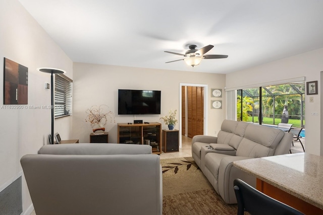 15471 SW 83rd Ave, Palmetto Bay, FL 33157 - carpeted living room with ceiling fan and baseboards