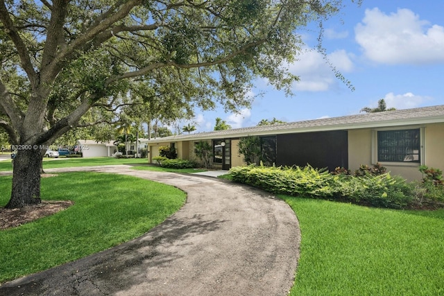15471 SW 83rd Ave, Palmetto Bay, FL 33157 - ranch-style house featuring a front lawn, stucco siding, and curved driveway