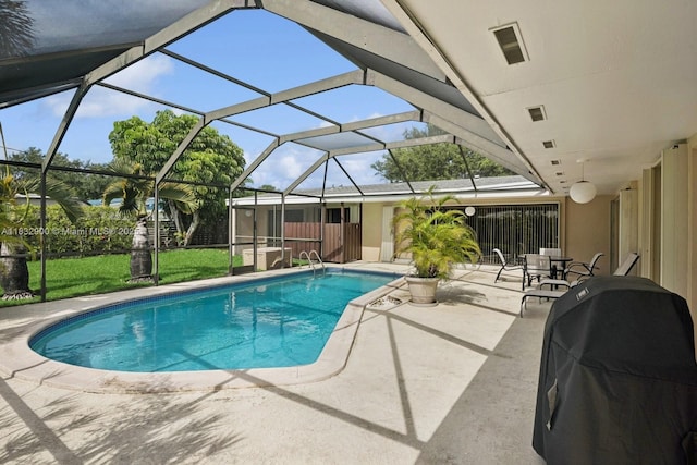 15471 SW 83rd Ave, Palmetto Bay, FL 33157 - swimming pool with a patio area, a grill, a lawn, and glass enclosure
