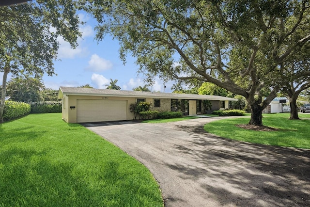 15471 SW 83rd Ave, Palmetto Bay, FL 33157 - single story home featuring asphalt driveway, an attached garage, stucco siding, and a front lawn