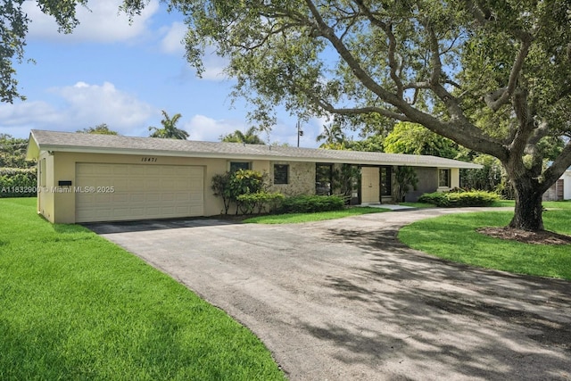 15471 SW 83rd Ave, Palmetto Bay, FL 33157 - ranch-style house with asphalt driveway, a garage, a front lawn, and stucco siding