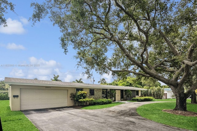 15471 SW 83rd Ave, Palmetto Bay, FL 33157 - ranch-style house featuring asphalt driveway, a garage, stucco siding, and a front lawn