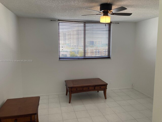 3703 NE 166th St Unit 905, North Miami Beach, FL 33160 - empty room featuring ceiling fan and a textured ceiling