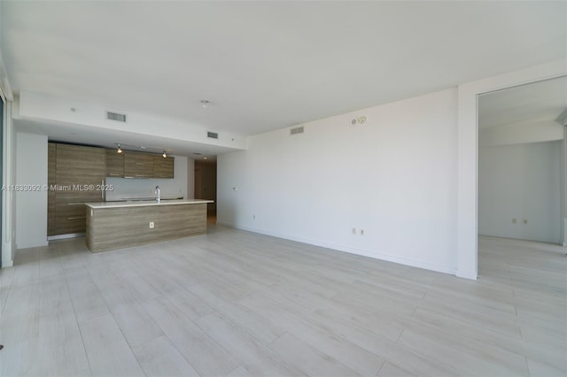 650 NE 32nd St Unit 4301, Miami, FL 33137 - unfurnished living room with light wood-style flooring
