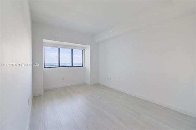 650 NE 32nd St Unit 4301, Miami, FL 33137 - empty room with light wood-type flooring and baseboards