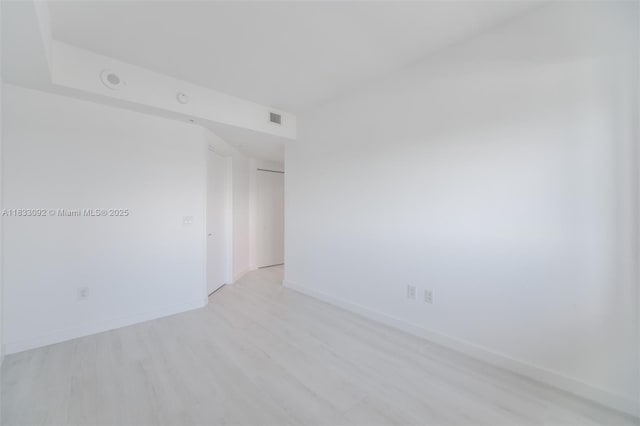 650 NE 32nd St Unit 4301, Miami, FL 33137 - unfurnished room with baseboards and light wood finished floors