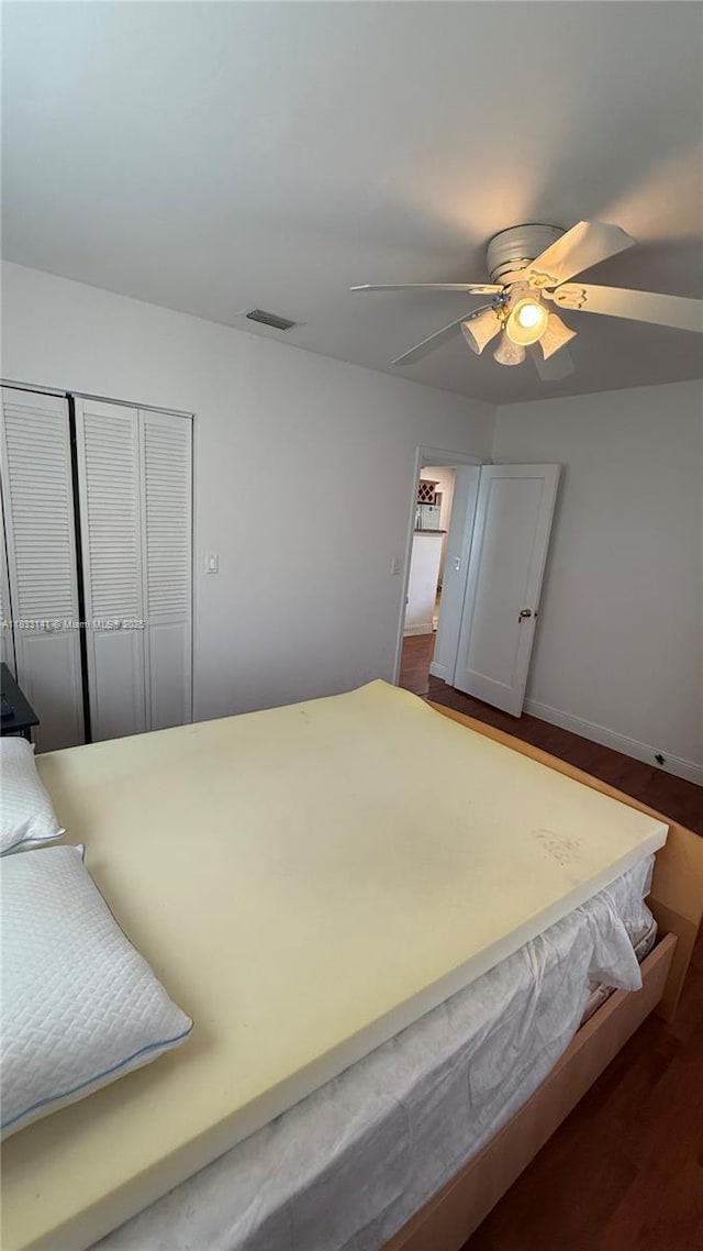 110 SW 64th Ct, Miami, FL 33144 - bedroom with dark wood finished floors, a ceiling fan, and a closet