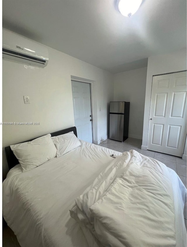 110 SW 64th Ct, Miami, FL 33144 - bedroom with freestanding refrigerator, an AC wall unit, and light tile patterned floors