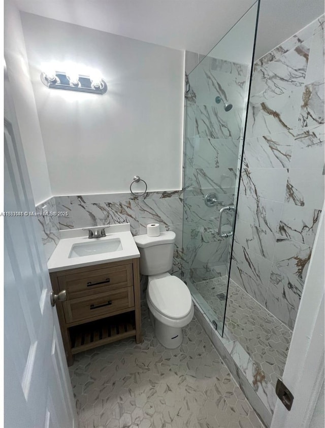110 SW 64th Ct, Miami, FL 33144 - full bath with a marble finish shower, vanity, wainscoting, and tile walls