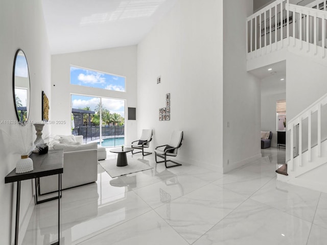 171 NW 152nd Ave, Pembroke Pines, FL 33028 - living room featuring high vaulted ceiling, stairway, and marble tiled floors