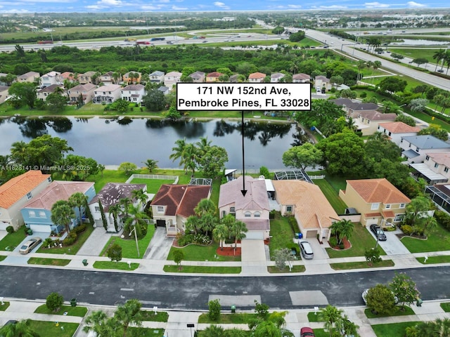 171 NW 152nd Ave, Pembroke Pines, FL 33028 - aerial perspective of suburban area with a large body of water