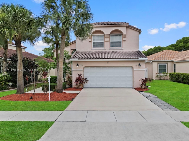 171 NW 152nd Ave, Pembroke Pines, FL 33028 - mediterranean / spanish house featuring an attached garage, a tiled roof, driveway, and stucco siding