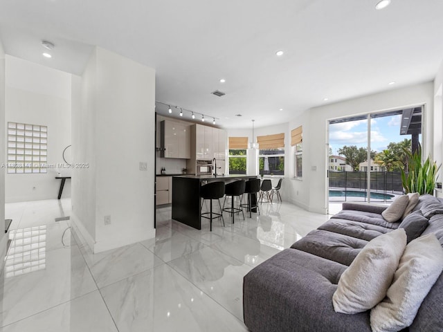 171 NW 152nd Ave, Pembroke Pines, FL 33028 - living room featuring recessed lighting