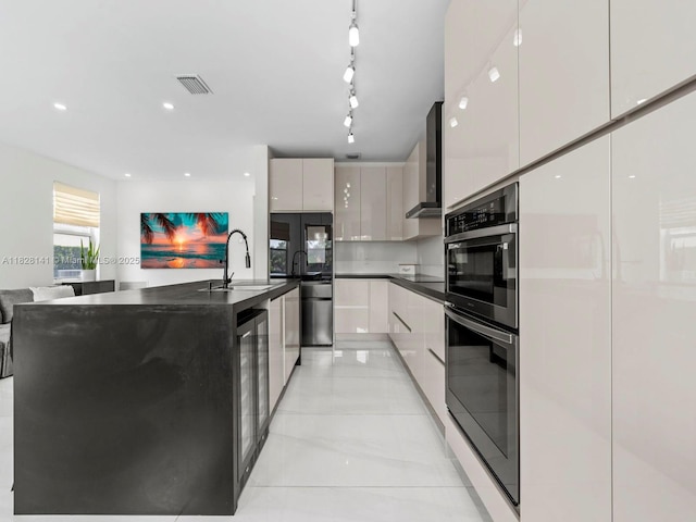 171 NW 152nd Ave, Pembroke Pines, FL 33028 - kitchen featuring modern cabinets, double oven, dark countertops, and wall chimney range hood