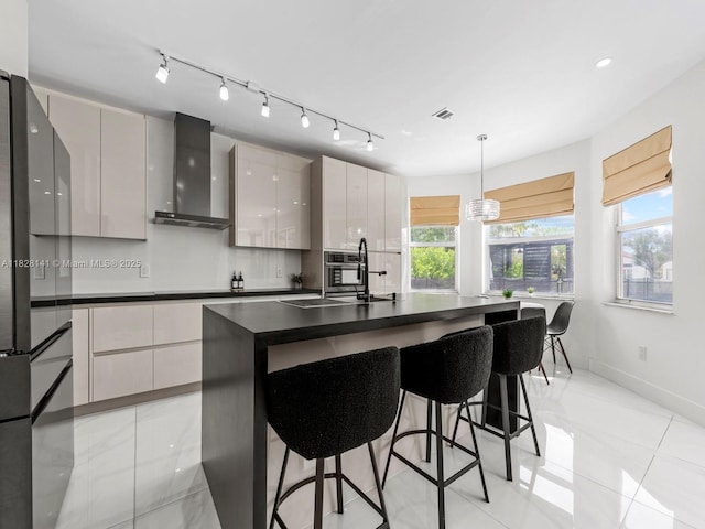171 NW 152nd Ave, Pembroke Pines, FL 33028 - kitchen with wall chimney exhaust hood, modern cabinets, dark countertops, and a breakfast bar