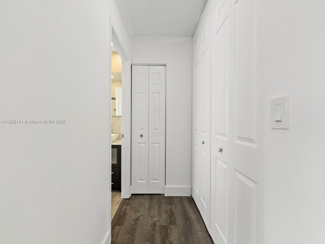 171 NW 152nd Ave, Pembroke Pines, FL 33028 - hallway featuring dark wood-style floors and baseboards