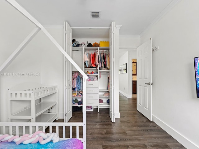 171 NW 152nd Ave, Pembroke Pines, FL 33028 - bedroom featuring a closet, wood finished floors, and ornamental molding