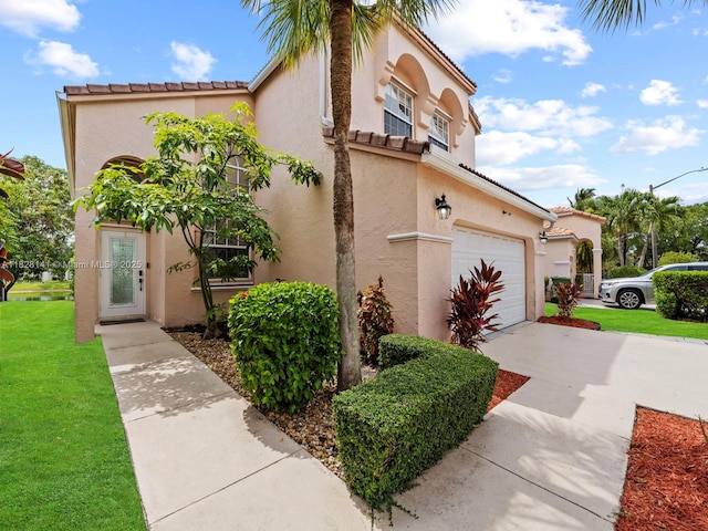 171 NW 152nd Ave, Pembroke Pines, FL 33028 - view of front of home featuring concrete driveway, a front yard, stucco siding, and a tile roof
