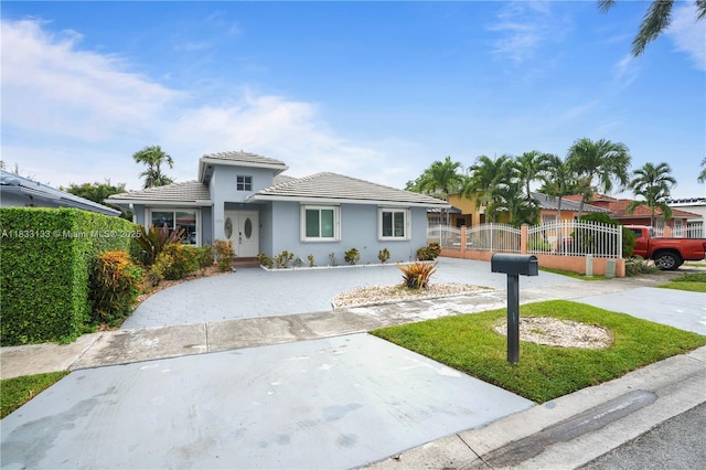 1173 NW 134th Pl, Miami, FL 33182 - view of front of home with stucco siding and a tile roof