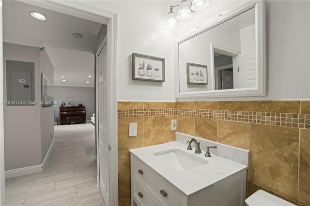 1173 NW 134th Pl, Miami, FL 33182 - bathroom with vanity, tile walls, ornamental molding, and a wainscoted wall