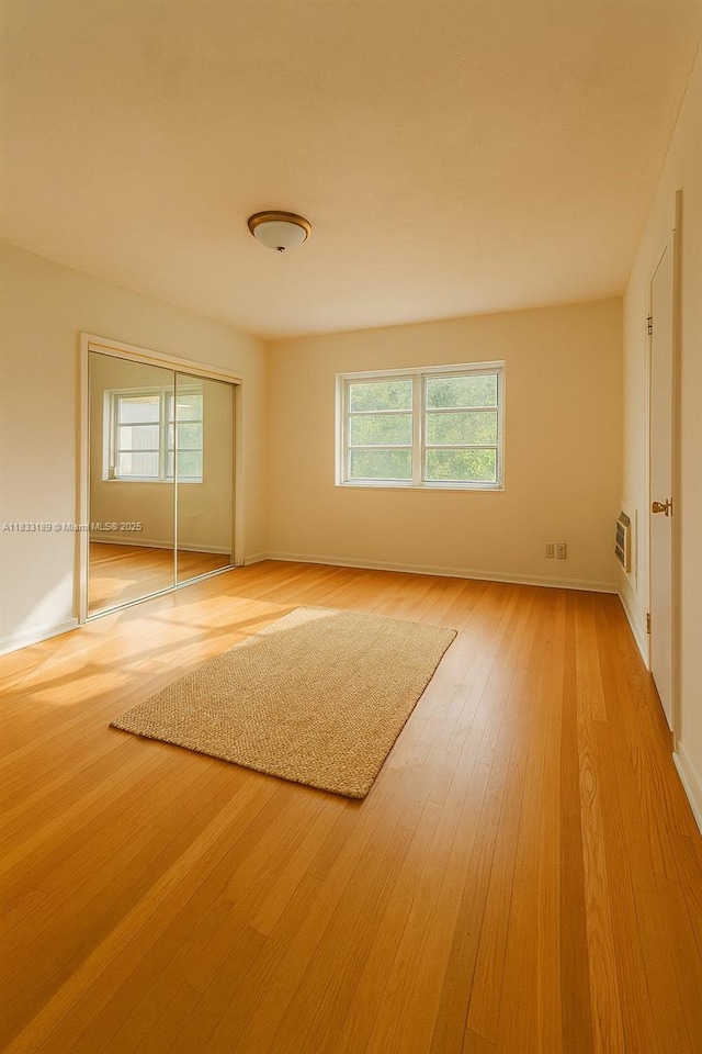 1180 NE 102nd St, Miami Shores, FL 33138 - unfurnished room with light wood-type flooring and baseboards
