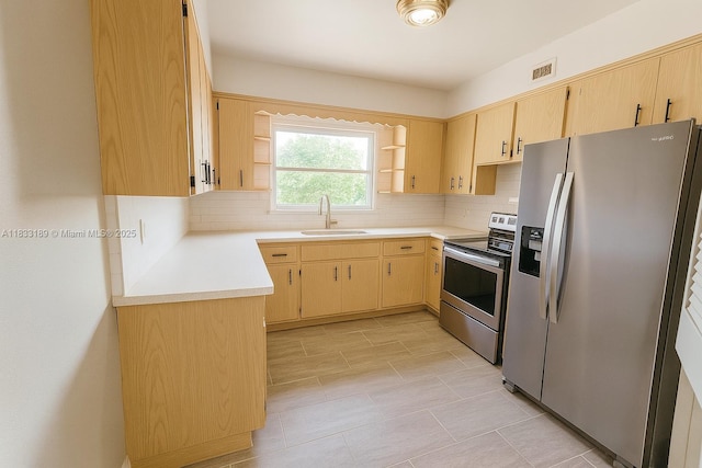 1180 NE 102nd St, Miami Shores, FL 33138 - kitchen with appliances with stainless steel finishes, light brown cabinets, backsplash, and light countertops