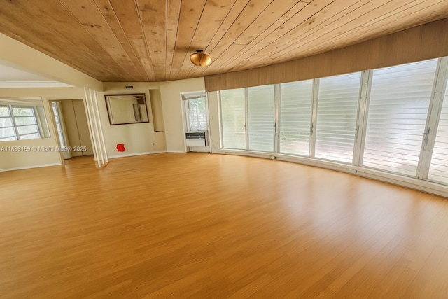 1180 NE 102nd St, Miami Shores, FL 33138 - spare room with light wood finished floors, wood ceiling, and cooling unit