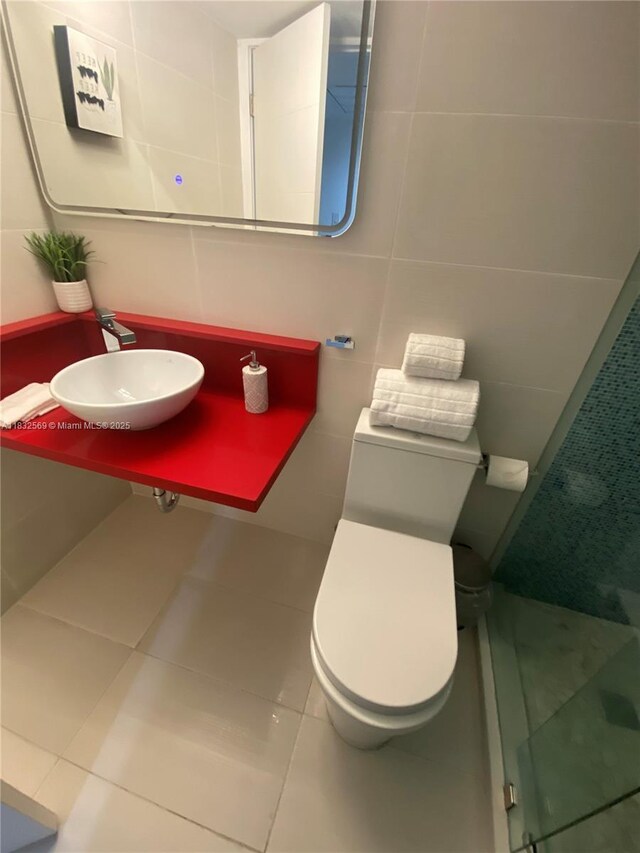 19201 Collins Ave Unit 130, Sunny Isles Beach, FL 33160 - full bathroom with tile patterned floors, tile walls, and a stall shower