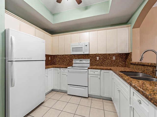 8912 W Flagler St Unit 103, Miami, FL 33174 - kitchen with white appliances, light tile patterned floors, backsplash, ceiling fan, and a raised ceiling