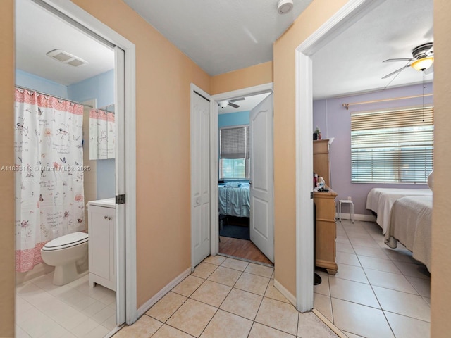 8912 W Flagler St Unit 103, Miami, FL 33174 - bathroom featuring ensuite bathroom, ceiling fan, tile patterned floors, vanity, and curtained shower