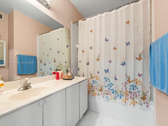 8912 W Flagler St Unit 103, Miami, FL 33174 - full bath with vanity, tile patterned floors, and a shower with shower curtain