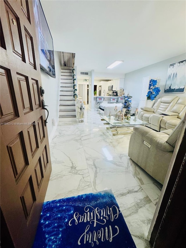 5072 W 12th Ln Unit D-14, Hialeah, FL 33012 - living room featuring stairway and marble finish flooring