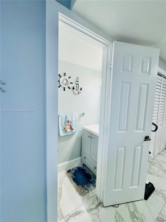5072 W 12th Ln Unit D-14, Hialeah, FL 33012 - bathroom with marble look tiles and vanity