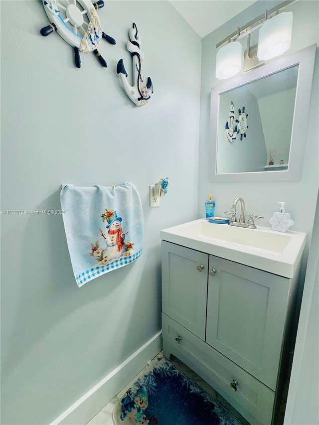 5072 W 12th Ln Unit D-14, Hialeah, FL 33012 - bathroom featuring baseboards and vanity