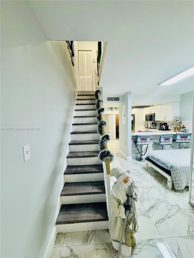 5072 W 12th Ln Unit D-14, Hialeah, FL 33012 - stairs with marble finish flooring and baseboards
