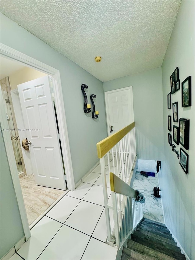 5072 W 12th Ln Unit D-14, Hialeah, FL 33012 - staircase with a textured ceiling
